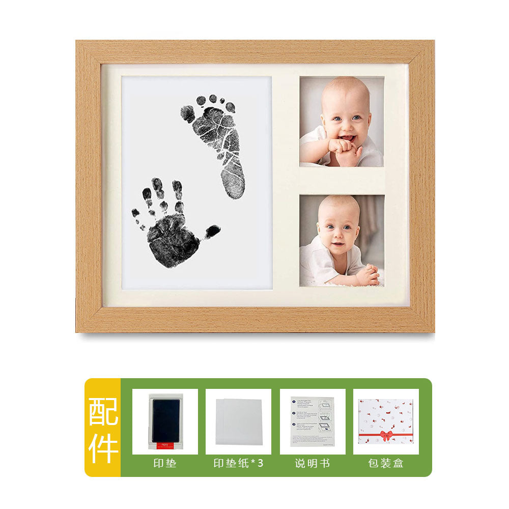 DIY hollow photo frame with baby's 100-day and first birthday hand and footprints, pet paw prints, and baby hand and footprint clay keepsakes.