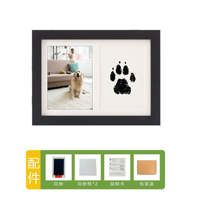 DIY hollow photo frame with baby's 100-day and first birthday hand and footprints, pet paw prints, and baby hand and footprint clay keepsakes.