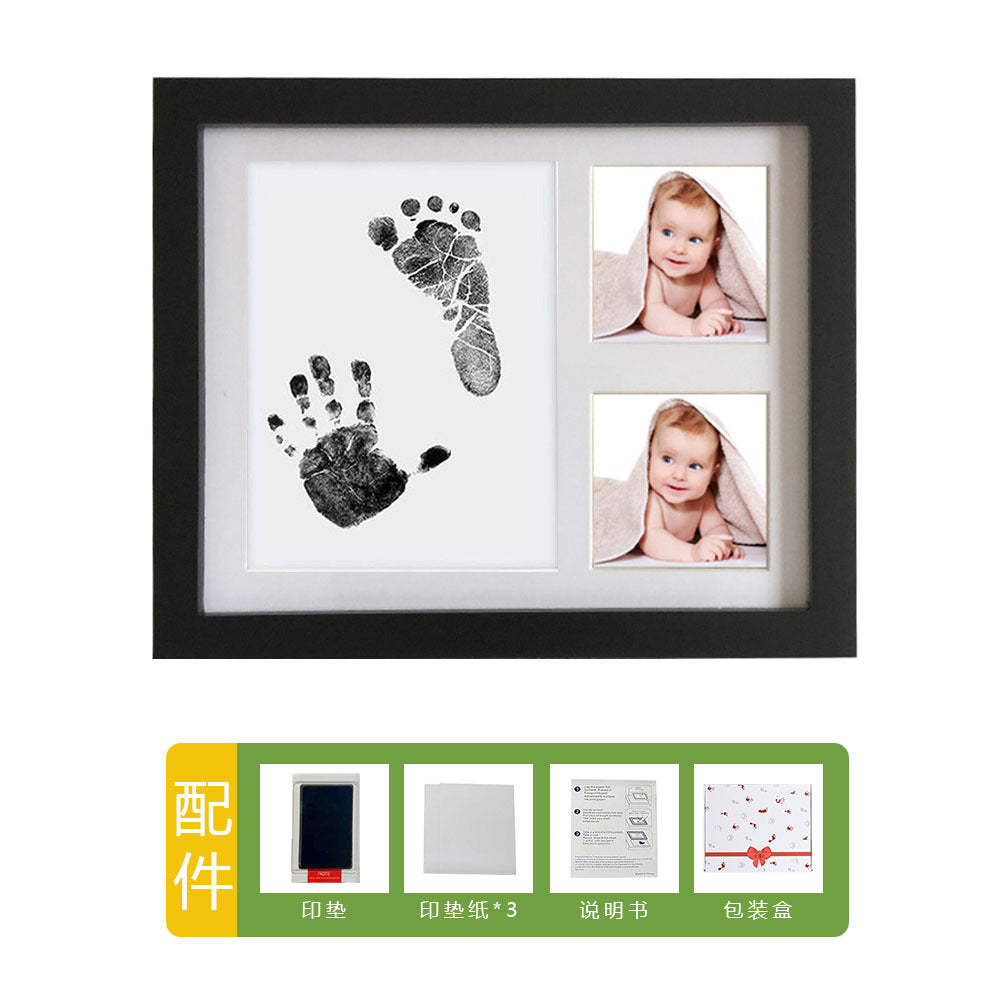 DIY hollow photo frame with baby's 100-day and first birthday hand and footprints, pet paw prints, and baby hand and footprint clay keepsakes.