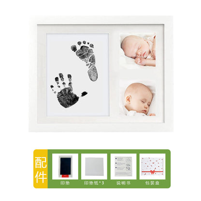 DIY hollow photo frame with baby's 100-day and first birthday hand and footprints, pet paw prints, and baby hand and footprint clay keepsakes.