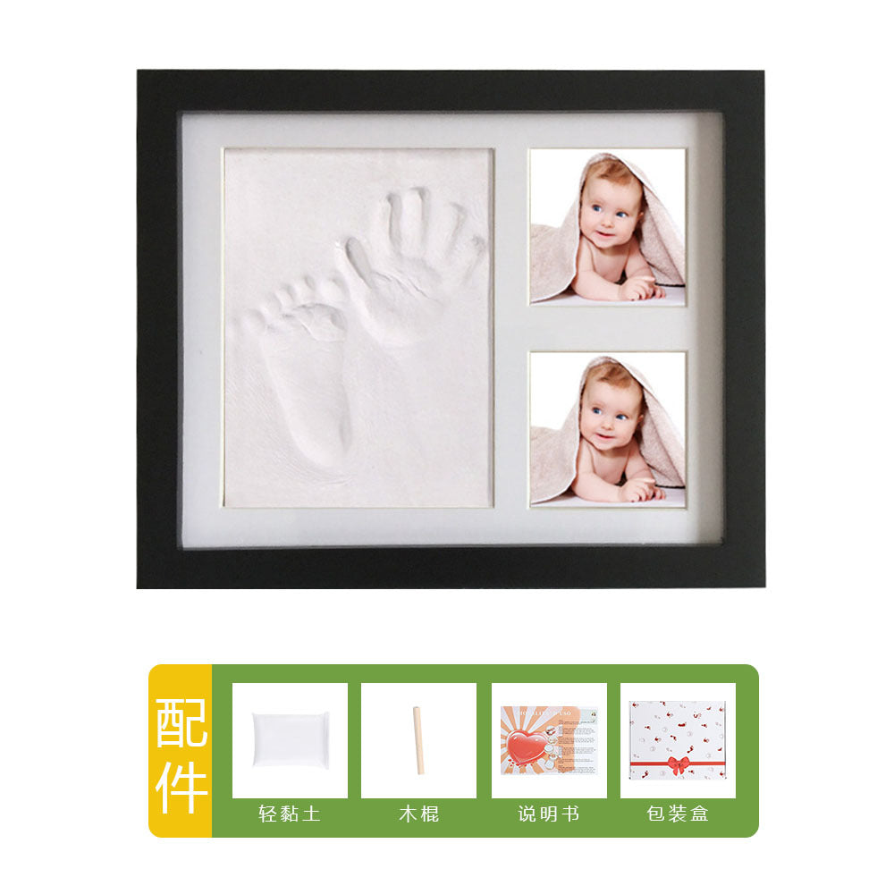 DIY hollow photo frame with baby's 100-day and first birthday hand and footprints, pet paw prints, and baby hand and footprint clay keepsakes.