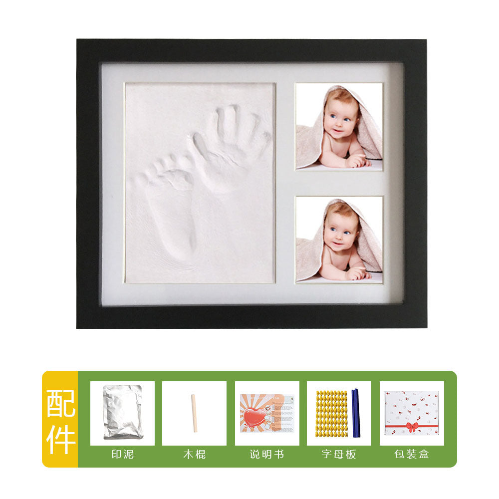 DIY hollow photo frame with baby's 100-day and first birthday hand and footprints, pet paw prints, and baby hand and footprint clay keepsakes.