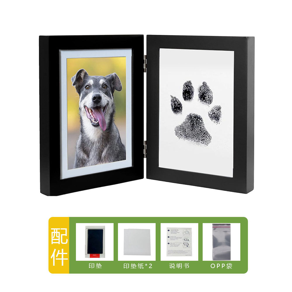 DIY hollow photo frame with baby's 100-day and first birthday hand and footprints, pet paw prints, and baby hand and footprint clay keepsakes.