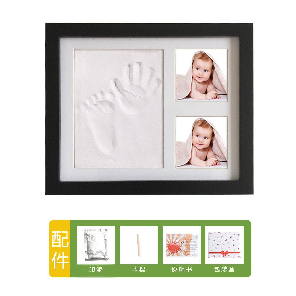 DIY hollow photo frame with baby's 100-day and first birthday hand and footprints, pet paw prints, and baby hand and footprint clay keepsakes.