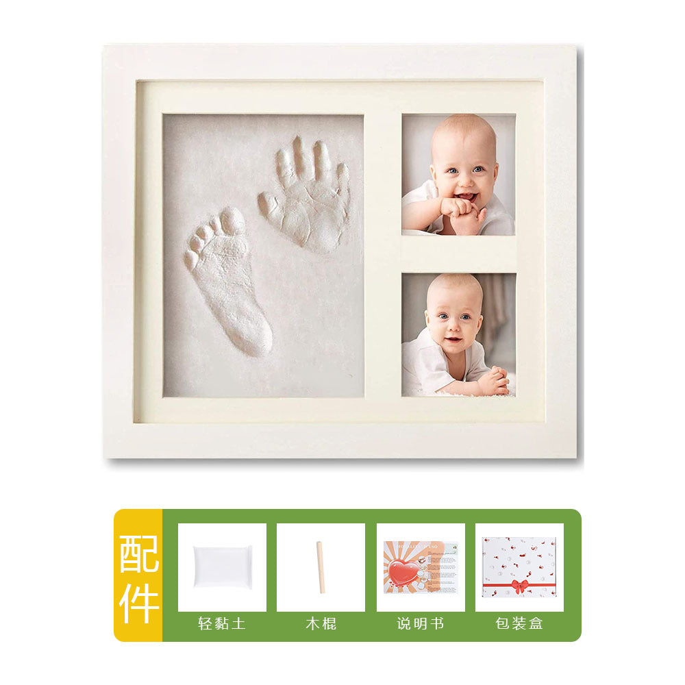 DIY hollow photo frame with baby's 100-day and first birthday hand and footprints, pet paw prints, and baby hand and footprint clay keepsakes.