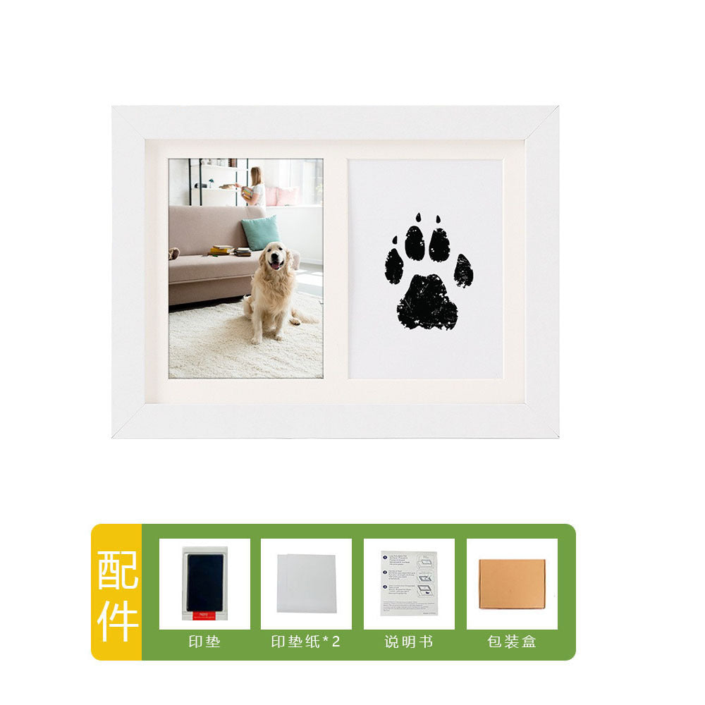 DIY hollow photo frame with baby's 100-day and first birthday hand and footprints, pet paw prints, and baby hand and footprint clay keepsakes.