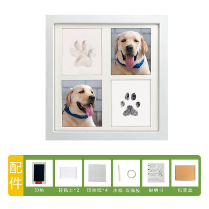 DIY hollow photo frame with baby's 100-day and first birthday hand and footprints, pet paw prints, and baby hand and footprint clay keepsakes.