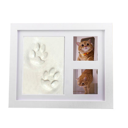 DIY hollow photo frame with baby's 100-day and first birthday hand and footprints, pet paw prints, and baby hand and footprint clay keepsakes.