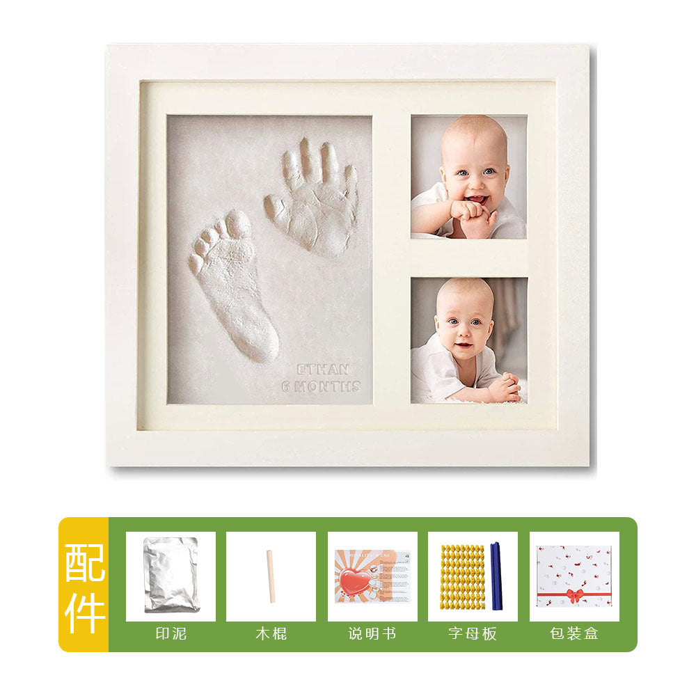 DIY hollow photo frame with baby's 100-day and first birthday hand and footprints, pet paw prints, and baby hand and footprint clay keepsakes.